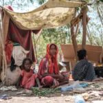 Tigrayans displaced by the conflict rest in a makeshift tent in the city of Semera, Ethiopia (AFP)