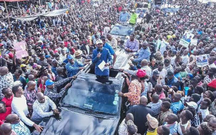 Kenyan opposition leader addresses a massive crowd from the roof of a vehicle during a coastal rally, as part of the 'One Term Movement' campaign targeting President Ruto’s administration.